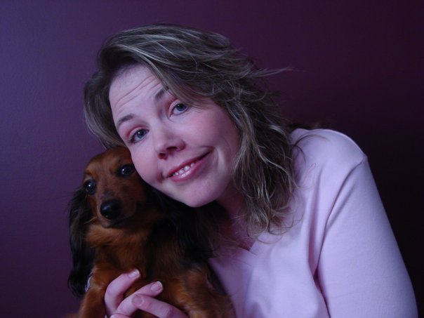 a woman holding a dog